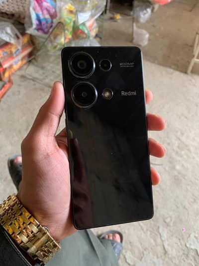 "REDMI NOT 13 PRO" .  STORAGE " 512"   RAM "12+12".  COLOUR "BLACK "