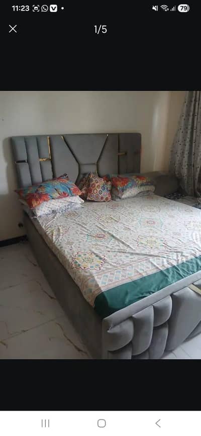 bed with two side table and dressing mirror