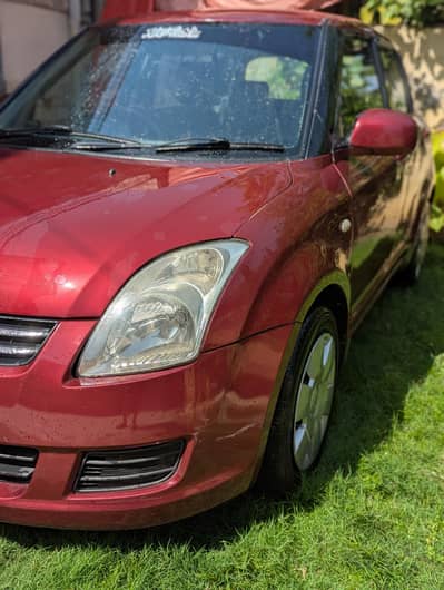 Suzuki swift DLX 2011 model red wine color
