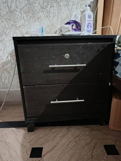 wooden bed with side drawers and dressing table