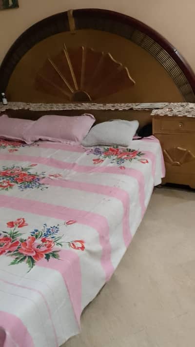 bed and dressing table used ha butt important wood