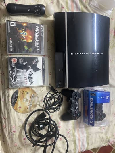 PS3 Fat PlayStation console along with accessories