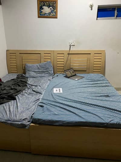 two single beds with a matching cupboard