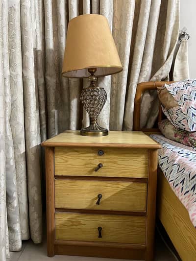 Wooden king size bed with side table and chairs