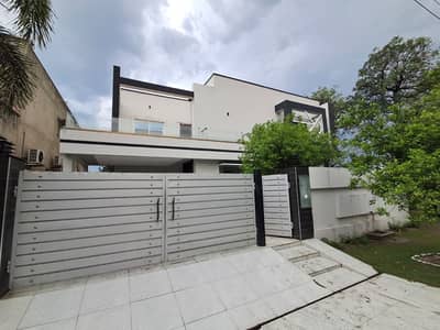 DOUBLE UNIT CORNER 1-KANAL OWNER BUILD ELEGANT AND FULLY MAINTAINED SUPER HOT LOCATED BUNGALOW IS AVAILABLE IN THE BEST BLOCK OF SUI GAS SOCIETY PHASE 1 ADJACENT PHASE 5 DHA LAHORE.