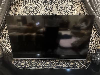 Almost new TCL LED with cabinet