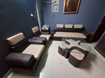 5 seater sofa set with center table and 4 chairs.