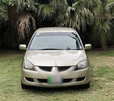 Mitsubishi Lancer GL 2004 model, 1300cc manual, excellent condition.