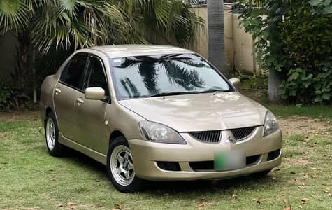 Mitsubishi Lancer GL 2004 model, 1300cc manual, excellent condition.
