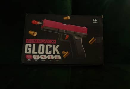 Automatic toy gun for kids. Plastic bullets with shell ejecting system