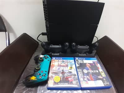 ps4 with 3 controller and a stand