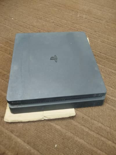 PS4 slim 1 tb with 2 controllers and 5 games