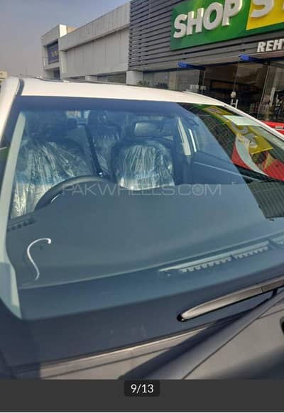 altis grande white with black interior 2025 October invoice