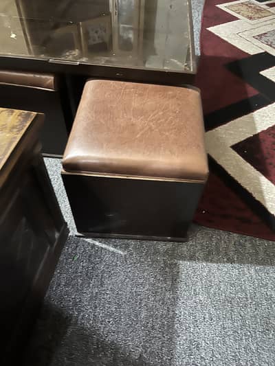 Coffee table with four sitting stools