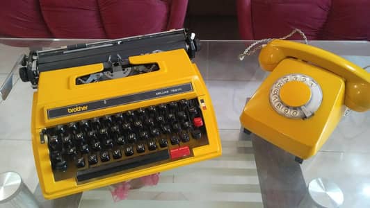 antique dialer telephone with typewriter