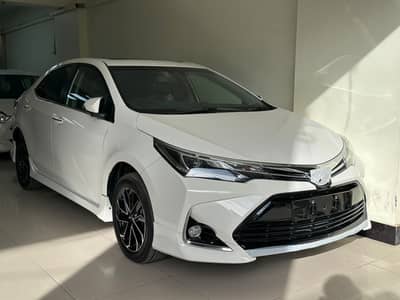 Toyota Corolla Grande White with black Room