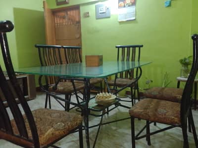Glass dining table with 6 iron chairs
