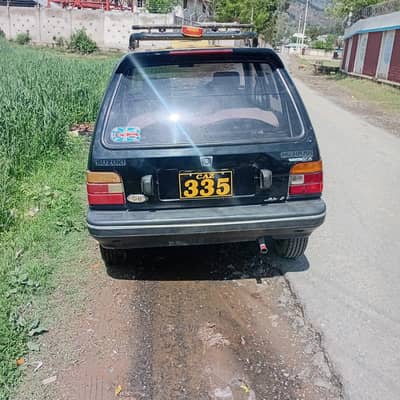Suzuki Mehran yellow cap