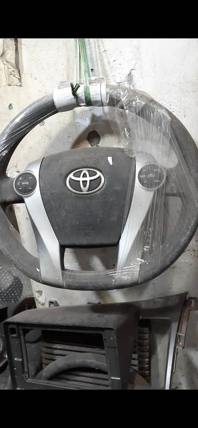 aqua and prius button