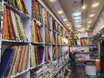 kapree ki shop ( shelves and racks and counter)