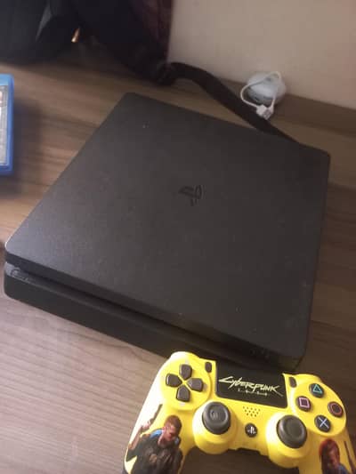 It's a playstation 4 slim 1 tb with two controllers and 3 games