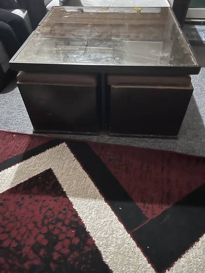 Coffee table with four sitting stools
