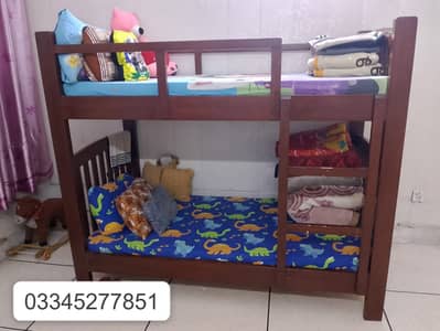Slightly used pure wooden bunk bed with 2 new matresses