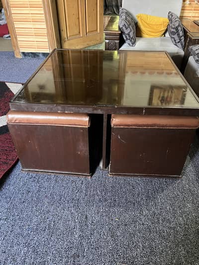 Coffee table with four sitting stools