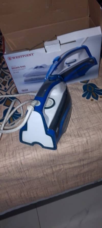 excellent condition automatic steam iron.