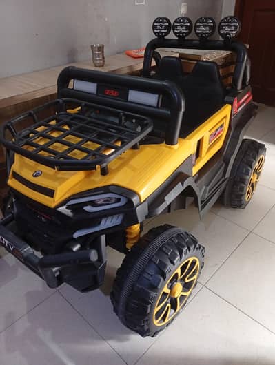 boys charging car with LCD panel