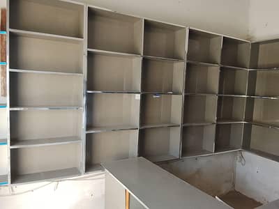 7 racks and 2 counter with one glass counte