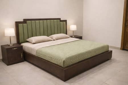wooden bed with one side tables