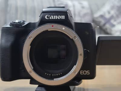 Canon M50 Mirrorless Camera (DSLR) with 11mm to 300mm lenses.