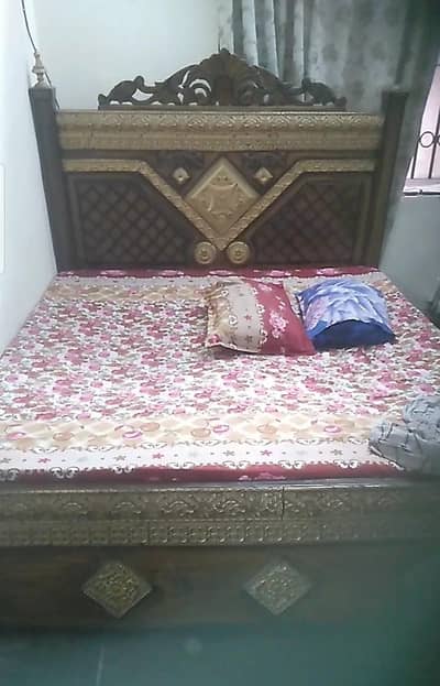 wooden bed with dressing table