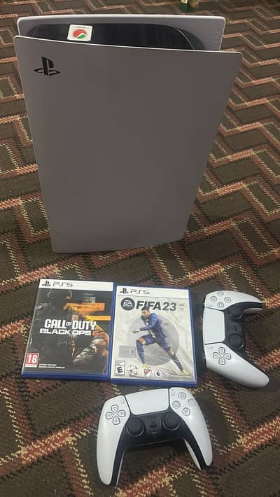 PS5 console with 2 controllera and 2 games