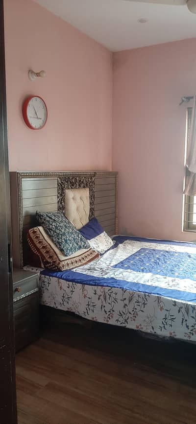 wooden king size  bed with two side tables