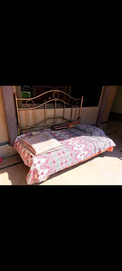 Double iron bed without mattress