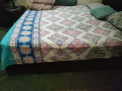 Complete bed set with a sit tables and mattress