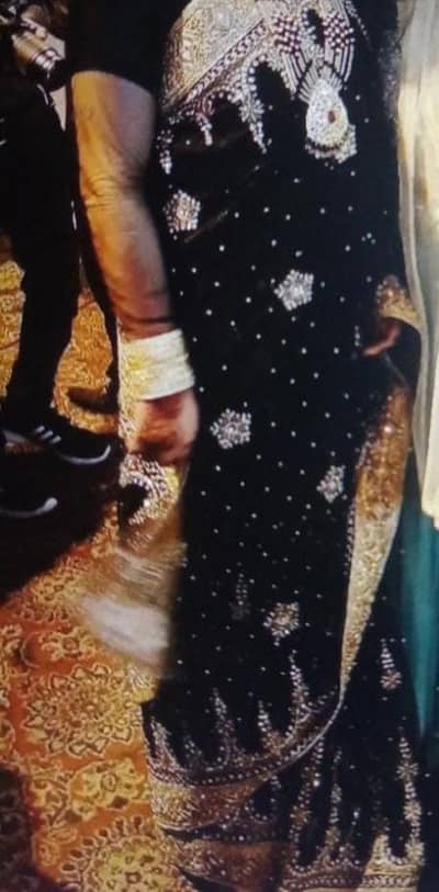 black and golden saree