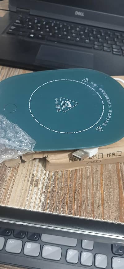 Green usb waemer pad to keep coffee and tea warm