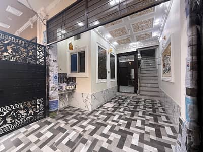 Brand New 2.5 Marla Triple Storey House For Sale Near Marghzar Officers Colony.