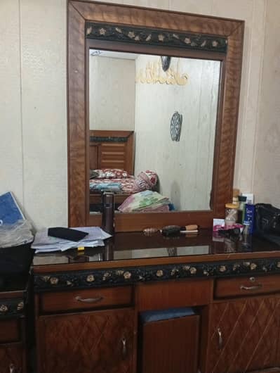 bed ,side tables and dressing ,with glass