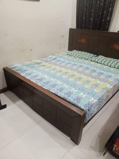 bed with dressing table and side tables