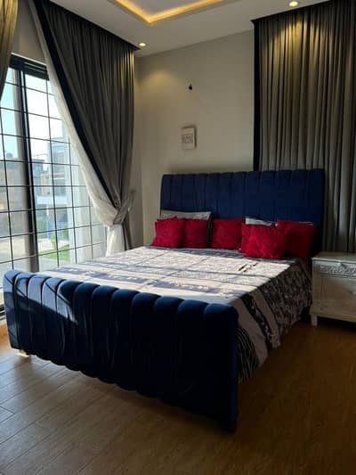 navy blue bed set with side tables
