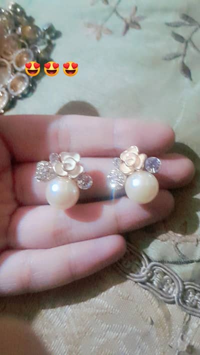 small earrings with white pearl and flower design