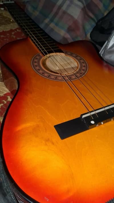 Beginner acoustic wooden guitar
