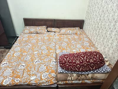 2 single beds with mattress and dressing