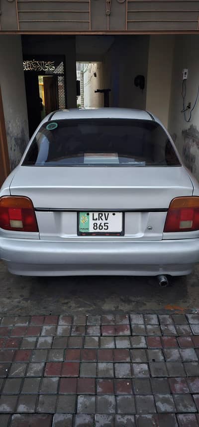 Suzuki Baleno 2004 Model 1300CC  08/10  Condition  Silver Grey