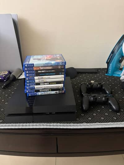 Playstation 4 + 2 controllers with game collection. Read Description