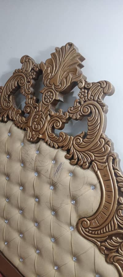 beautiful double bed along with two mirrored side tables